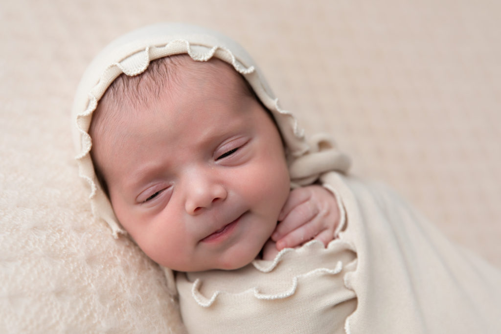 smiling newborn baby