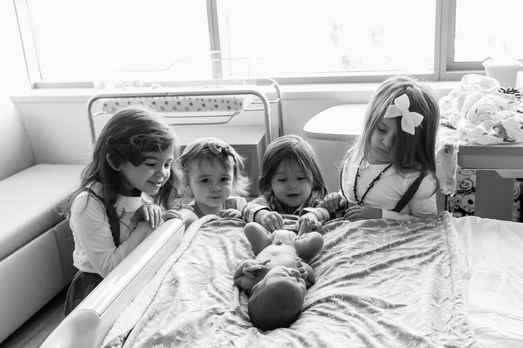 Waco Area Newborn Photographer siblings with new baby brother