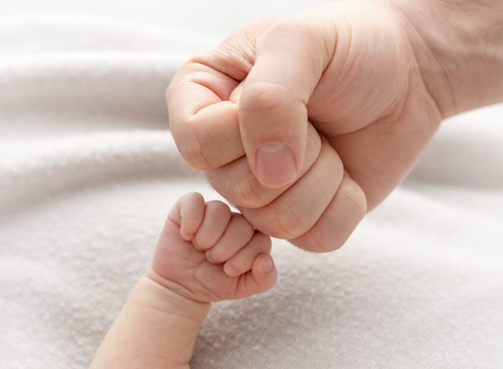 Waco Texas newborn Photography first fist bump with dad